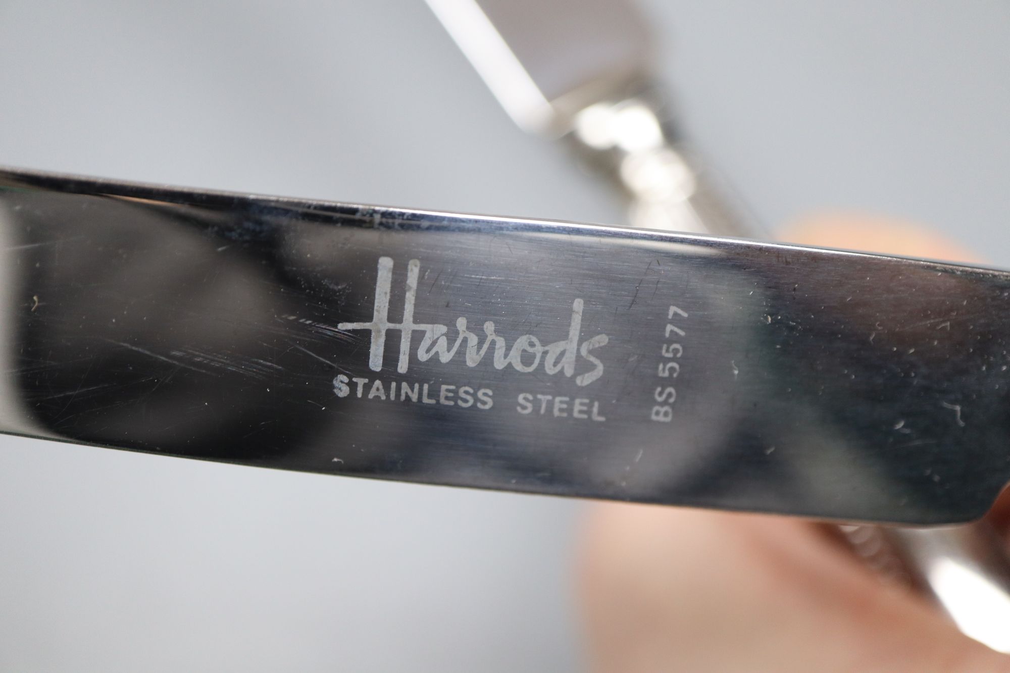 A cased set of 6 pairs of silver handled dessert knives & forks, a Peter Jackson Christmas spoon and a set of plated table knives